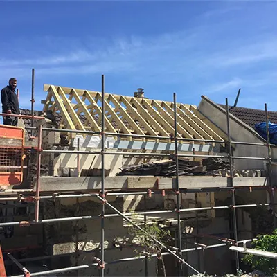 a man standing on top of a building under construction