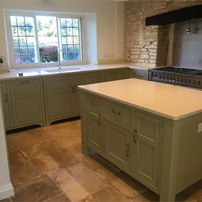 a large kitchen with a stove and a sink