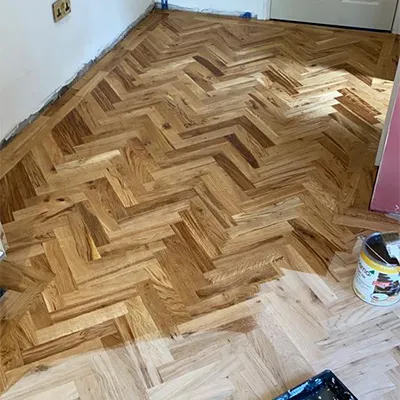 a room with a hard wood floor that has been sanded