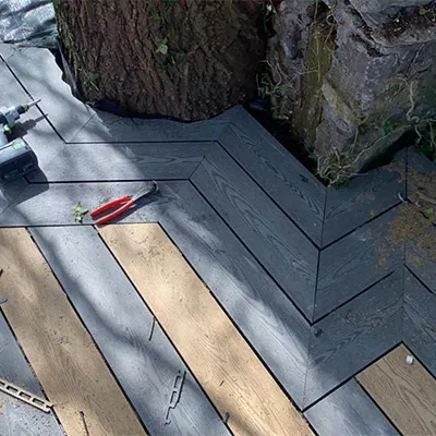 a wooden deck with tools laying on top of it