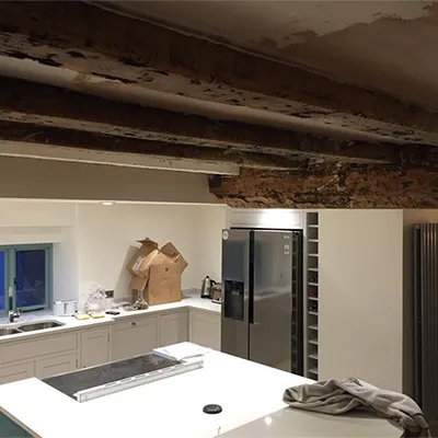 a kitchen with a refrigerator and a sink